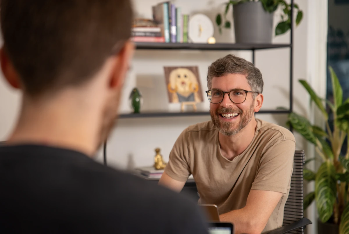A Geckoboard team member smiling during a call about a bespoke Zendesk data project