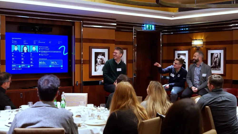 Geckoboard on stage talking through a live Zendesk support dashboard at a customer event